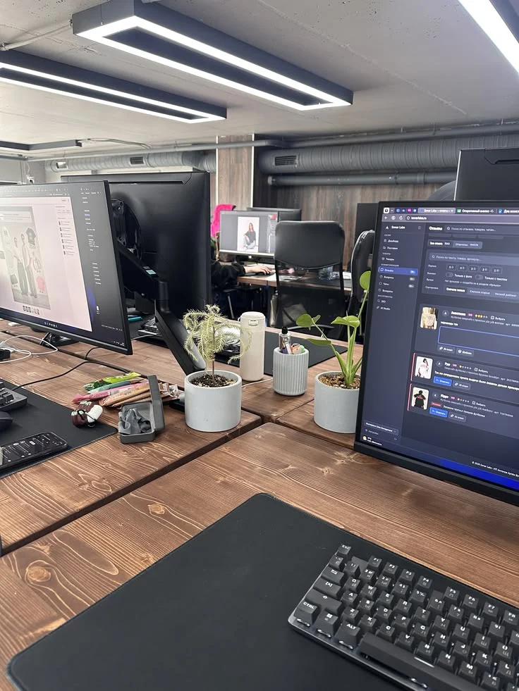 Office desks with desktop computers and monitors